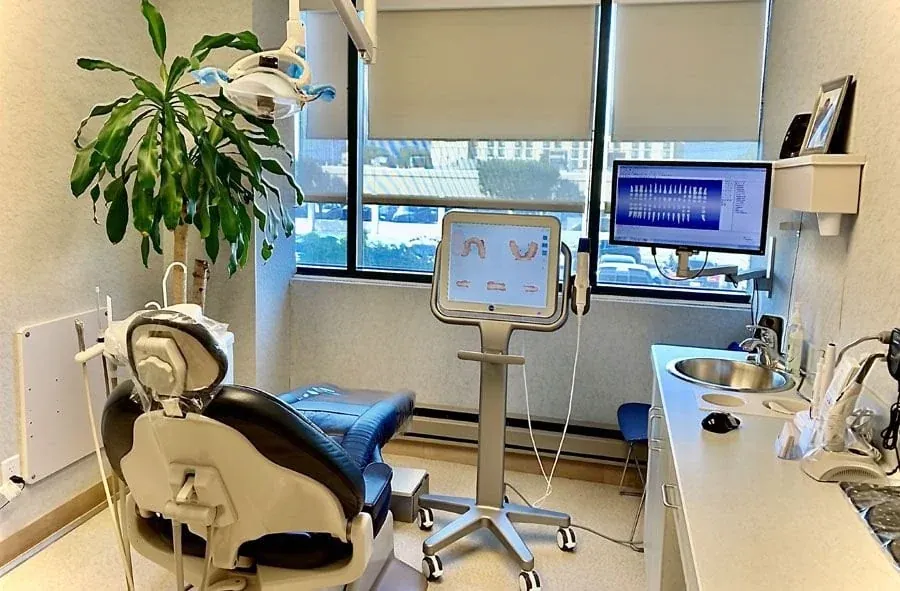 A treatment room at Garden City Dental Group with an intraoral scanner.